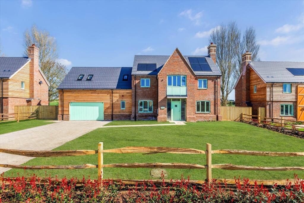 Standard estate agent listing photo of a detached house exterior, before video